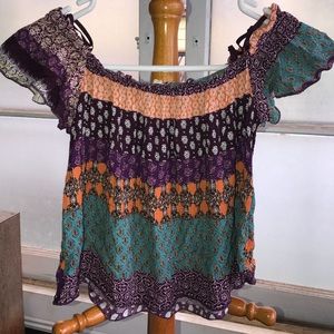 Cute gauzy off-shoulder crop top.